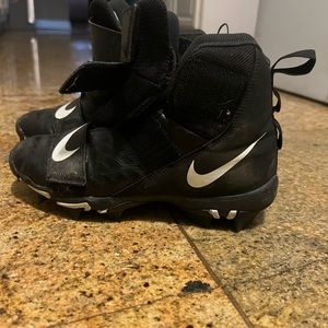 Boys Nike football cleats.